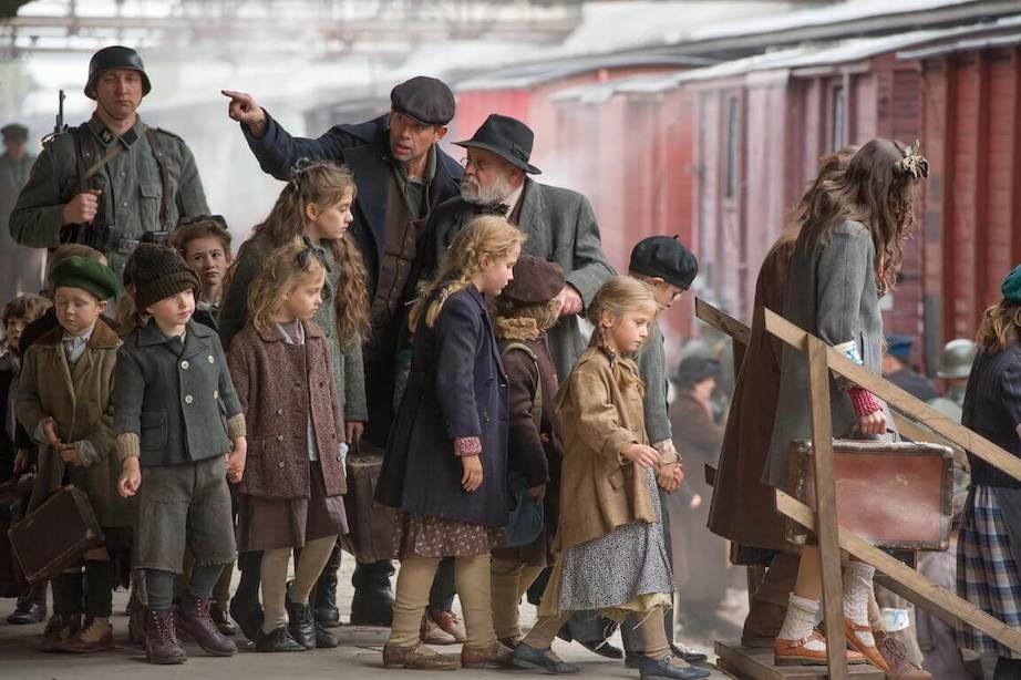 Jewish children evacuated from the ghetto; their suitcases are taken from them and they are loaded onto the train like goods